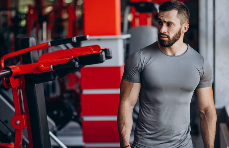 Strong man training in gym